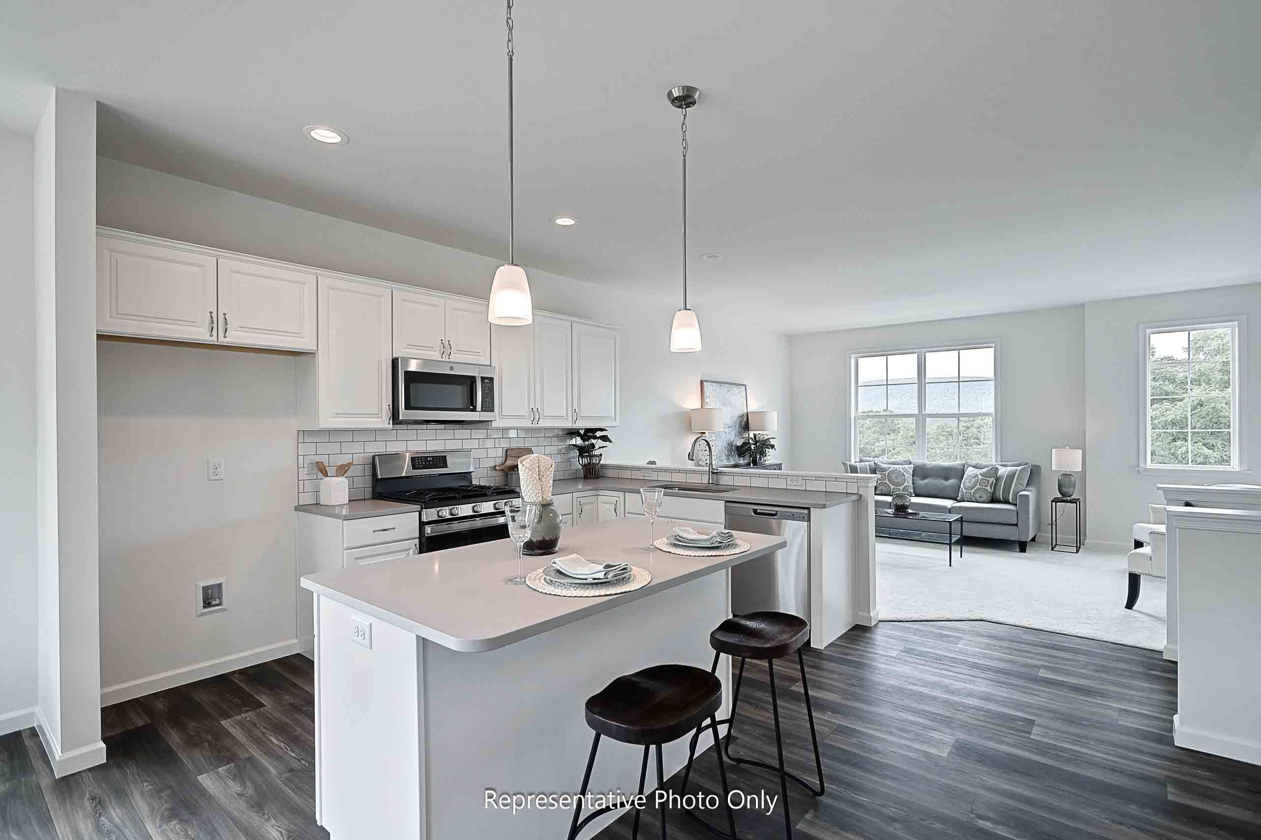 Modern kitchen with quartz countertops and stainless appliances