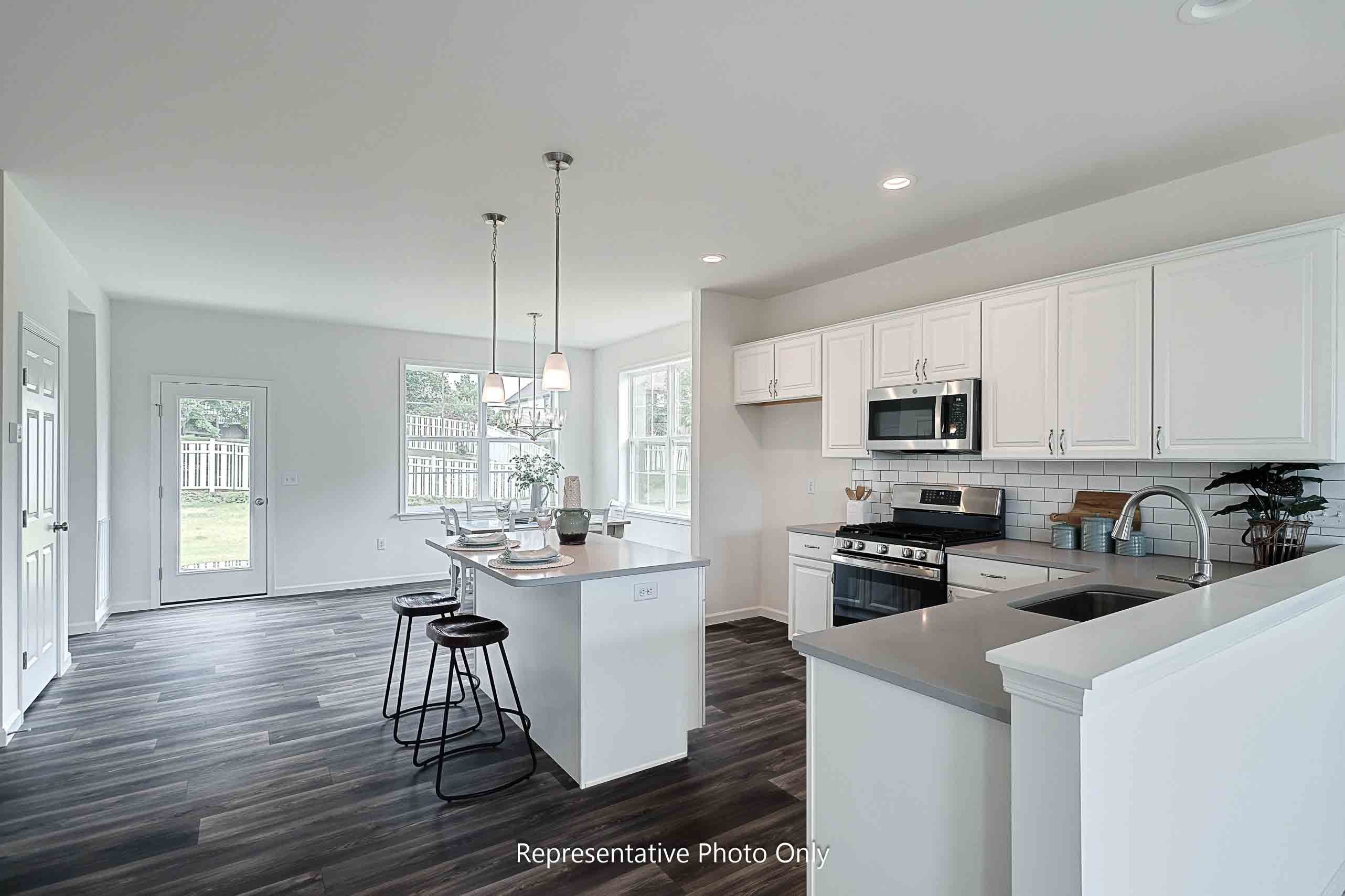 Open-concept living room with LVP flooring